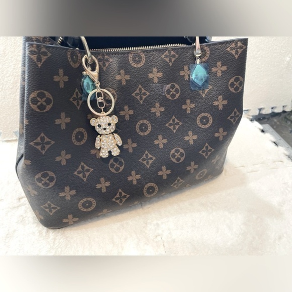 Golden Teddy Bear charm for luxury designer handbags.